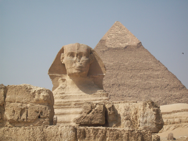  A View of the Great Sphinx of Giza beside a Pyramid