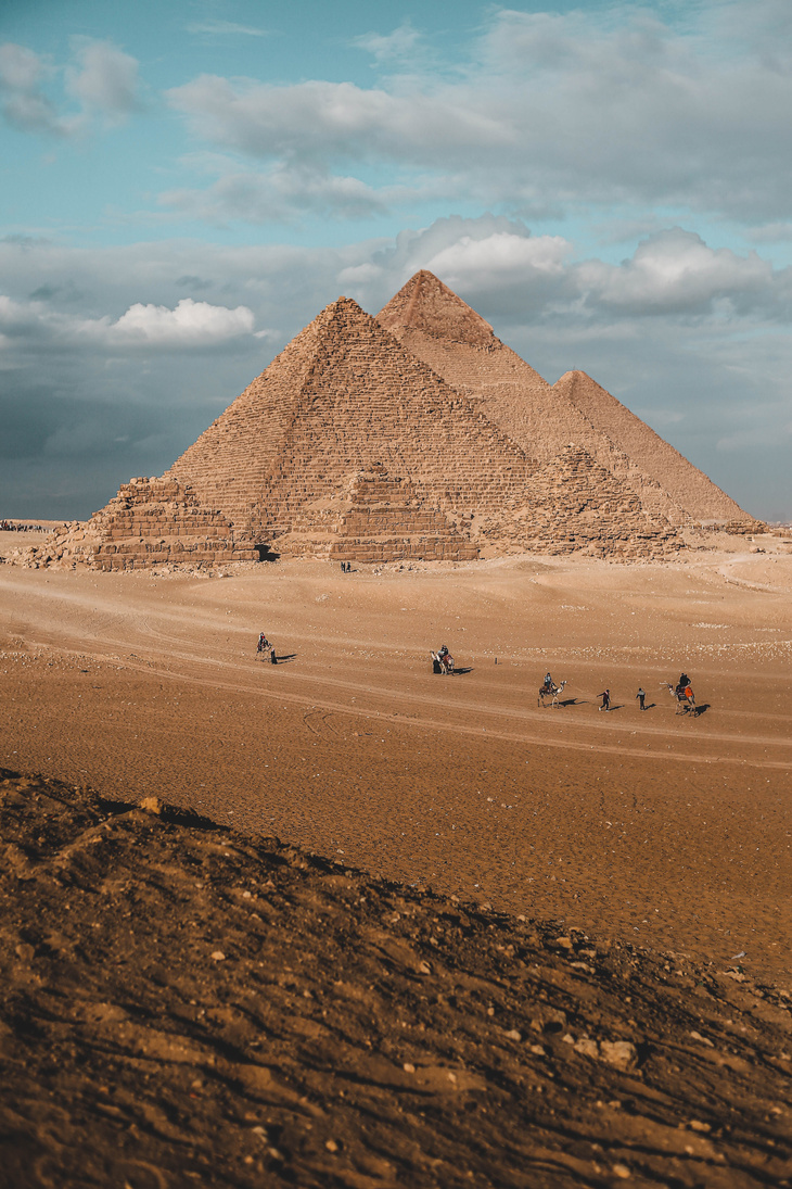 An Aerial Photography of People Walking Near the Pyramids